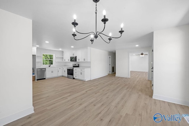 kitchen featuring white cabinets, appliances with stainless steel finishes, light wood finished floors, and recessed lighting