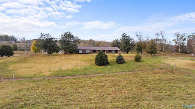 view of yard with a rural view