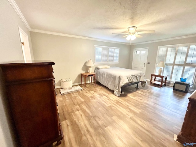 bedroom featuring ornamental molding, light hardwood / wood-style floors, a textured ceiling, and ceiling fan