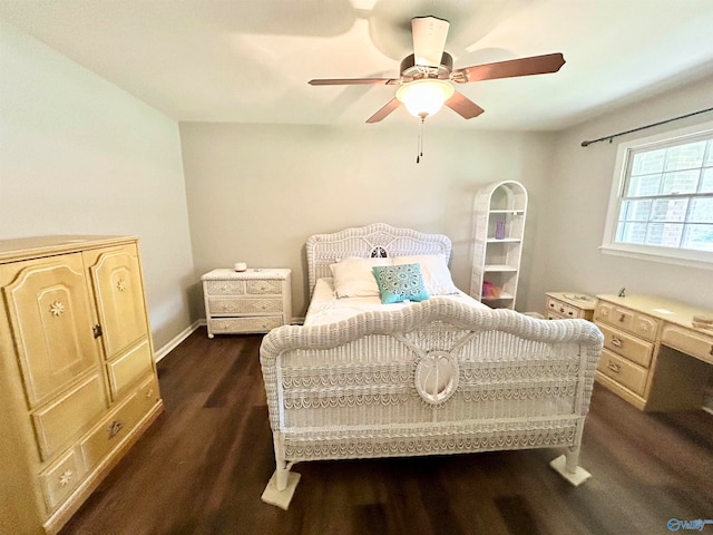 bedroom with ceiling fan and dark hardwood / wood-style floors