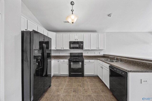 377 Robinson Rd, Huntsville, AL 35811 - kitchen with black appliances, dark countertops, and white cabinetry