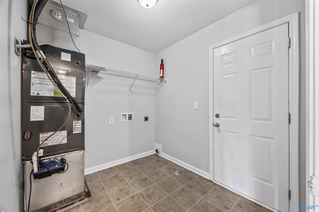 377 Robinson Rd, Huntsville, AL 35811 - laundry area featuring hookup for an electric dryer, heating unit, and hookup for a washing machine
