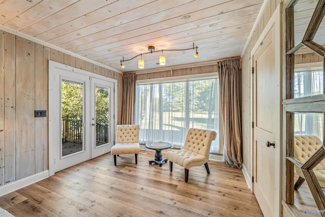 sunroom featuring french doors and wooden ceiling