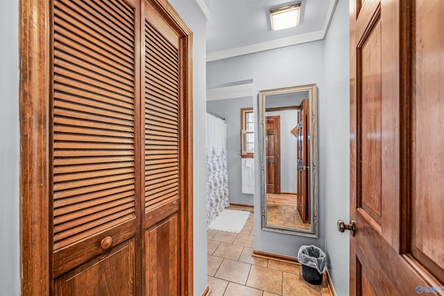 hallway with light tile patterned floors