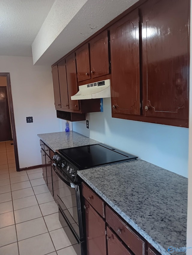 kitchen with light tile patterned floors, a textured ceiling, and black range with electric cooktop