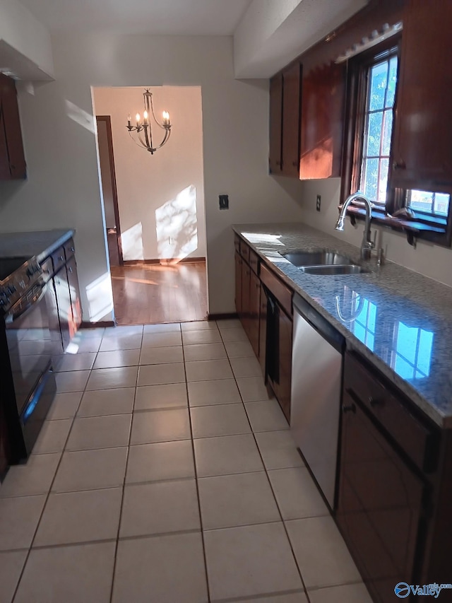 kitchen with stainless steel dishwasher, sink, light tile patterned floors, an inviting chandelier, and black electric range oven