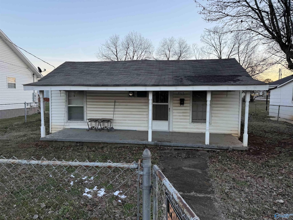 outdoor structure at dusk with covered porch