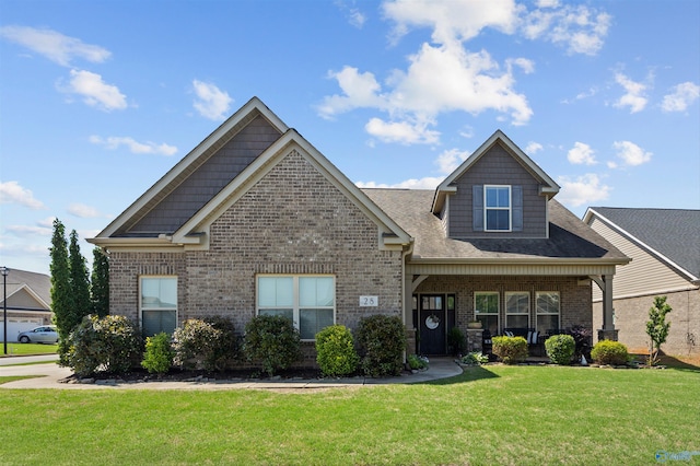 craftsman-style house featuring a porch, brick siding, and a front lawn