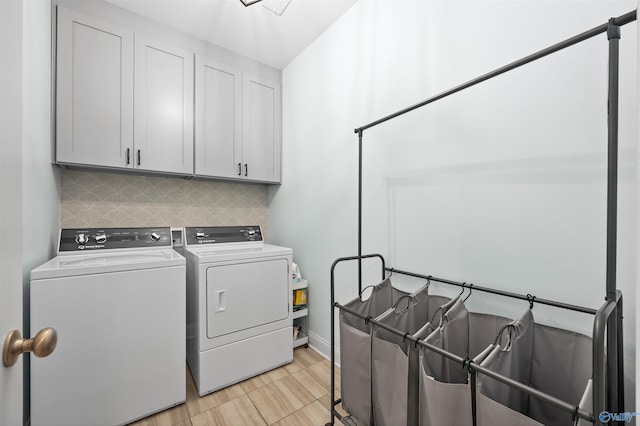 laundry room featuring cabinet space and washer and dryer