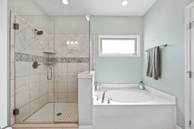 full bathroom with a stall shower, recessed lighting, and a bath