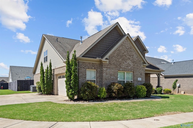 view of home's exterior with a lawn, central AC, brick siding, an attached garage, and driveway