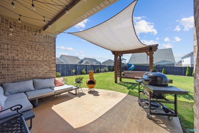 view of patio featuring a fenced backyard and an outdoor living space