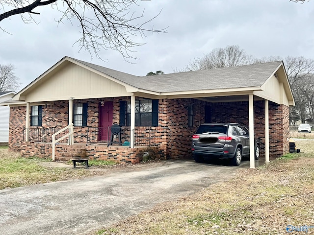 single story home featuring a carport and covered porch