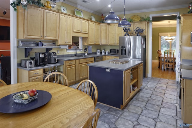 kitchen with appliances with stainless steel finishes, a sink, ornamental molding, a center island, and light brown cabinetry