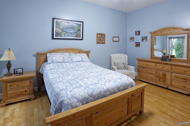 bedroom with light wood-style floors