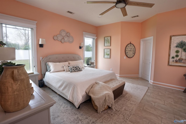 bedroom featuring a ceiling fan and baseboards