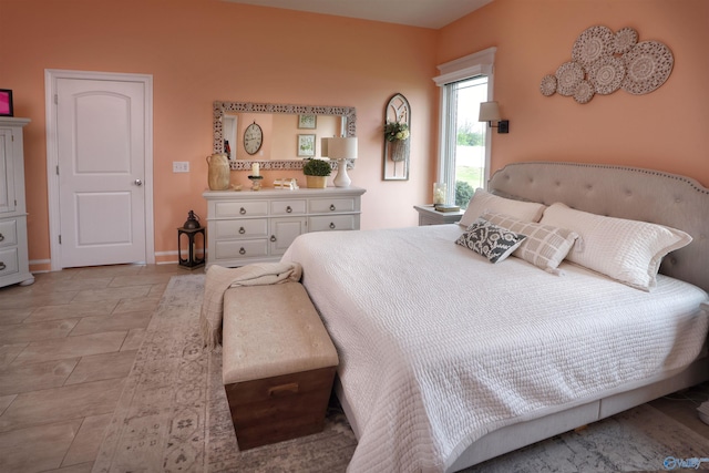 bedroom featuring baseboards