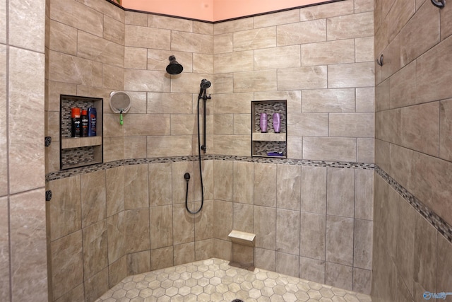 bathroom with tiled shower