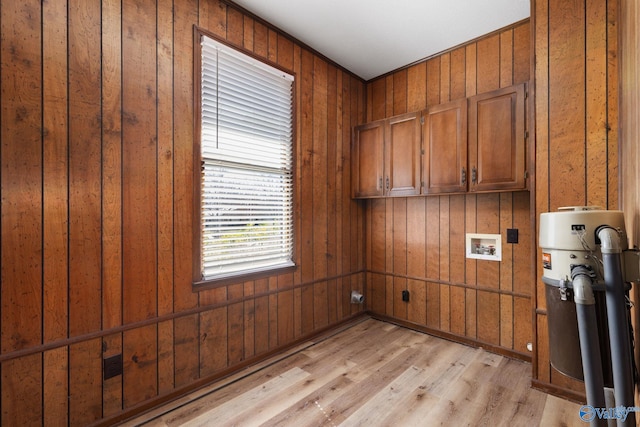 laundry area with washer hookup, cabinet space, and light wood finished floors