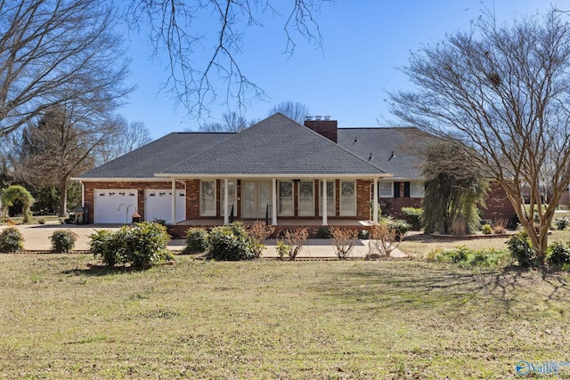 ranch-style house with brick siding, a front lawn, a chimney, and an attached garage