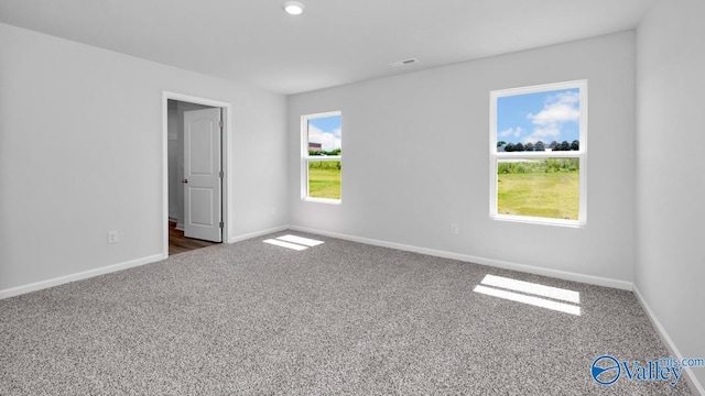 6156 Feather Way SE, Owens Cross Roads, AL 35763 - carpeted empty room featuring baseboards