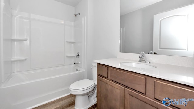 6156 Feather Way SE, Owens Cross Roads, AL 35763 - full bath with toilet, vanity, wood finished floors, and shower / bathtub combination