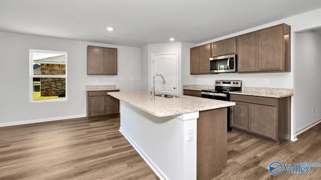 6156 Feather Way SE, Owens Cross Roads, AL 35763 - kitchen with appliances with stainless steel finishes, a sink, wood finished floors, baseboards, and recessed lighting