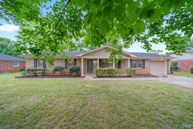 single story home with an attached garage, a front lawn, aphalt driveway, and brick siding