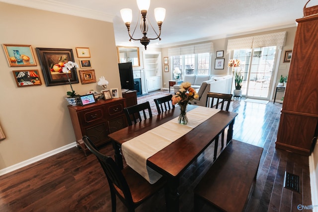 235 Inverness Dr Unit 235, Huntsville, AL 35802 - dining area featuring built in features, crown molding, wood finished floors, a chandelier, and baseboards