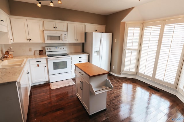 235 Inverness Dr Unit 235, Huntsville, AL 35802 - kitchen featuring white appliances, visible vents, dark wood-type flooring, and a sink