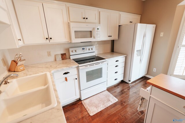 235 Inverness Dr Unit 235, Huntsville, AL 35802 - kitchen with dark wood finished floors, white appliances, a sink, and white cabinetry