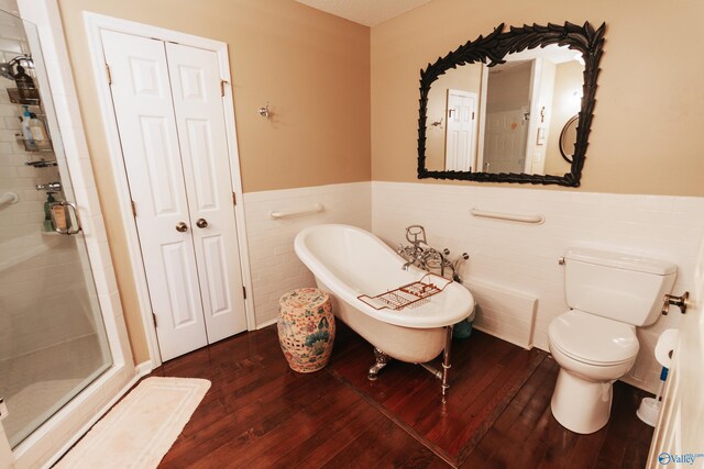 235 Inverness Dr Unit 235, Huntsville, AL 35802 - full bathroom with a soaking tub, a stall shower, wainscoting, and wood finished floors