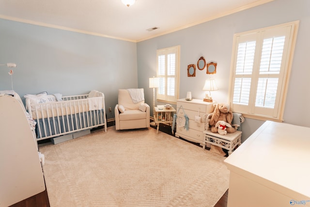 235 Inverness Dr Unit 235, Huntsville, AL 35802 - carpeted bedroom with a nursery area, visible vents, crown molding, and multiple windows