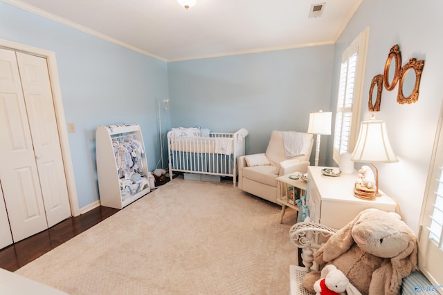 235 Inverness Dr Unit 235, Huntsville, AL 35802 - bedroom featuring a nursery area, baseboards, visible vents, and crown molding