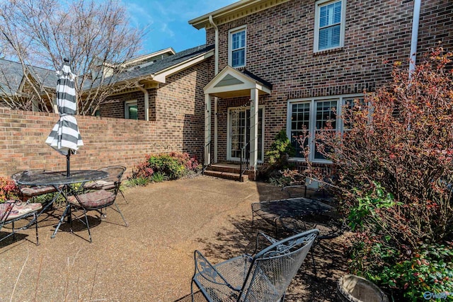 235 Inverness Dr Unit 235, Huntsville, AL 35802 - property entrance with brick siding, fence, and a patio