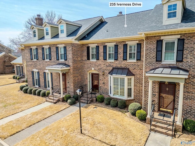 235 Inverness Dr Unit 235, Huntsville, AL 35802 - view of front of house with roof with shingles, a chimney, and brick siding