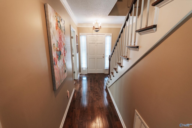 235 Inverness Dr Unit 235, Huntsville, AL 35802 - doorway to outside with a textured ceiling, visible vents, baseboards, ornamental molding, and dark wood finished floors