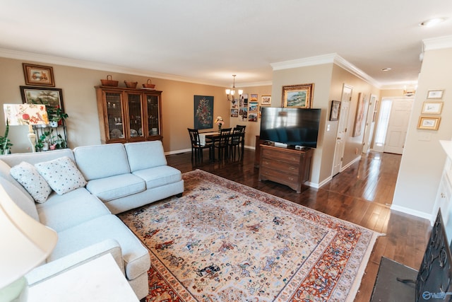 235 Inverness Dr Unit 235, Huntsville, AL 35802 - living area featuring dark wood-style floors, crown molding, baseboards, and an inviting chandelier