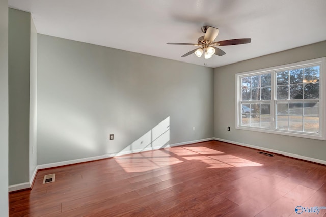 empty room featuring ceiling fan and hardwood / wood-style flooring