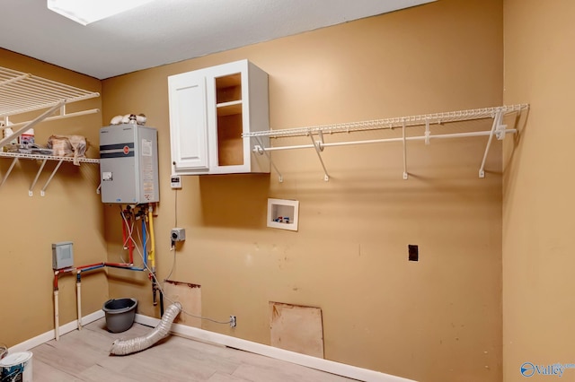 laundry room featuring hookup for a washing machine, tankless water heater, and hookup for an electric dryer