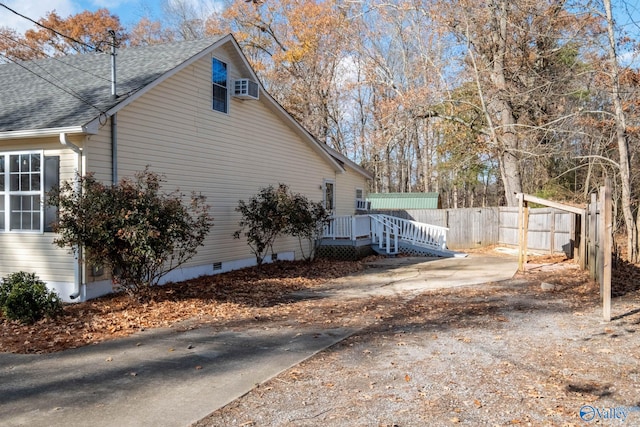 view of property exterior with a deck