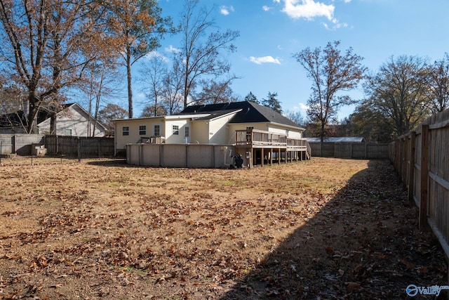 back of house featuring a pool side deck