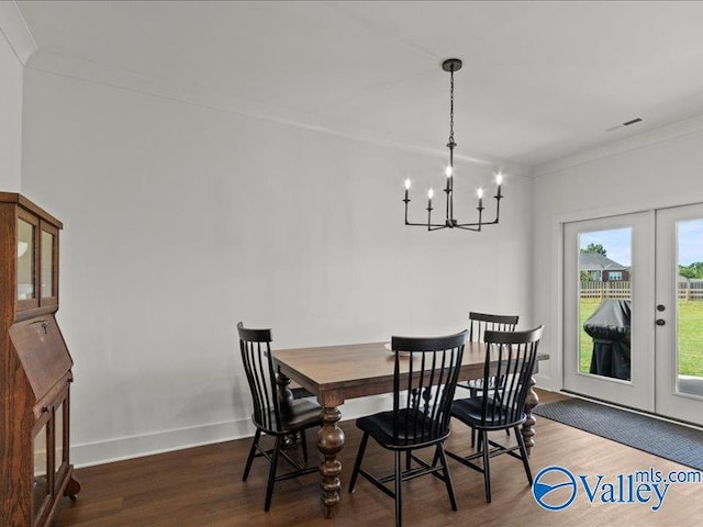 23819 Justin Brent Cir, Elkmont, AL 35620 - dining area featuring a chandelier, wood finished floors, french doors, baseboards, and crown molding