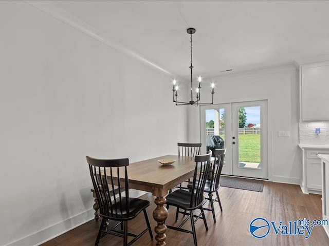 23819 Justin Brent Cir, Elkmont, AL 35620 - dining room with french doors, wood finished floors, a chandelier, baseboards, and ornamental molding