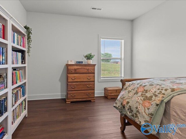 23819 Justin Brent Cir, Elkmont, AL 35620 - bedroom with dark wood-style floors and baseboards