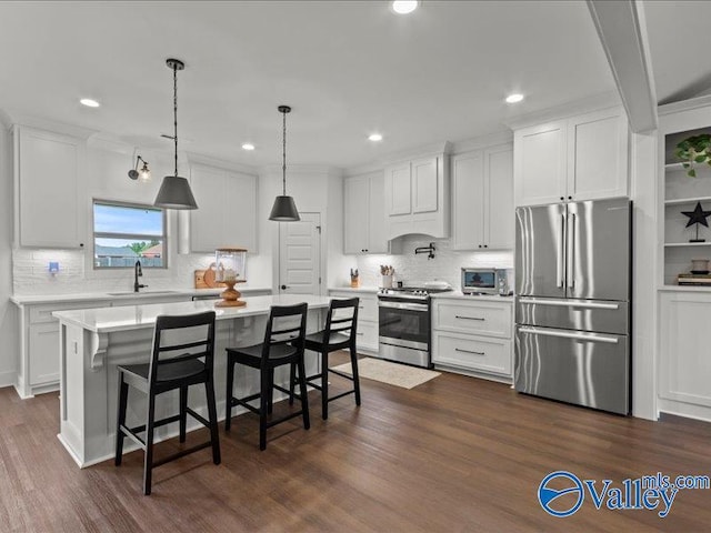 23819 Justin Brent Cir, Elkmont, AL 35620 - kitchen featuring appliances with stainless steel finishes, a sink, light countertops, white cabinets, and tasteful backsplash