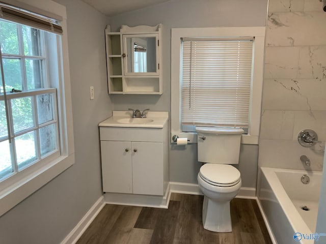 505 Mccullough Ave NE, Huntsville, AL 35801 - full bathroom featuring baseboards, wood finished floors, vanity, and toilet