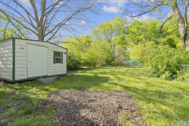 505 Mccullough Ave NE, Huntsville, AL 35801 - view of yard with an outdoor structure and a storage shed