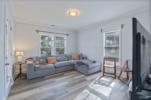505 Mccullough Ave NE, Huntsville, AL 35801 - living area with light wood-type flooring, visible vents, crown molding, and baseboards