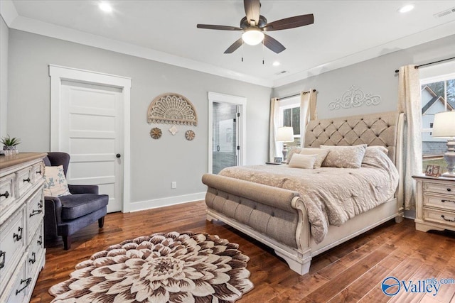 bedroom with crown molding, dark hardwood / wood-style floors, ceiling fan, and ensuite bathroom